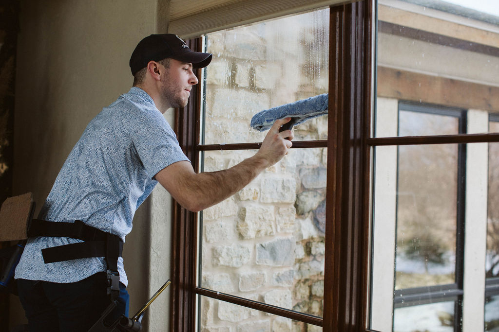 Professional interior window cleaning in a bright home